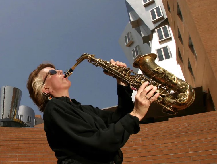 woman playing saxophone